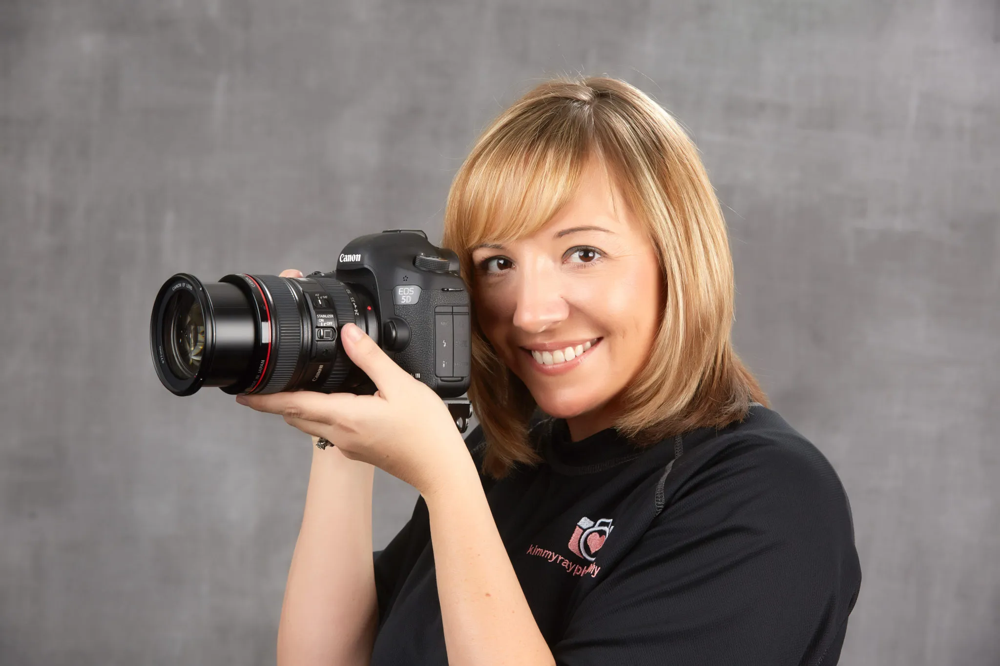 Kimmy Ray holding her camera